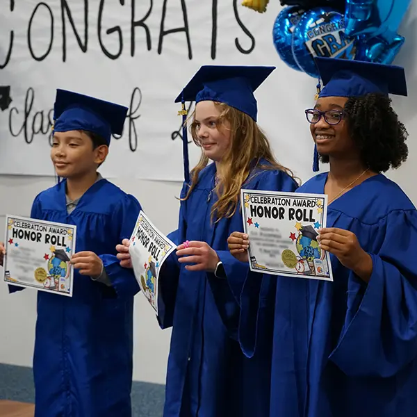 Merit School Private Elementary Education first 1st grade through 5th fifth grade - image of 2024 5th grade class graduates holding Honor Roll certificates.