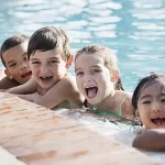 Summer Camp at The Merit School - kids having fun in swimming pool