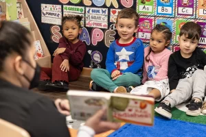 Merit School Gunston - Teacher reading to students