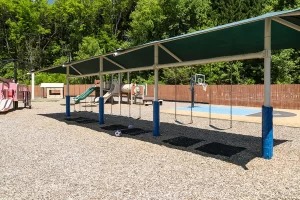 Merit School of Doc Stone - Large playground swings area